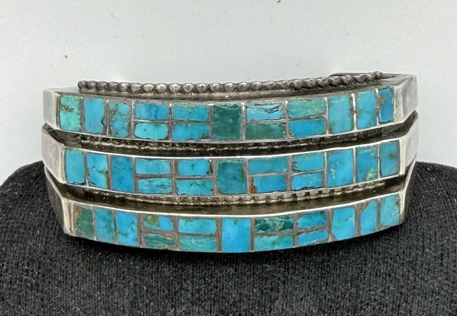 FRED HARVEY ERA STERLING TURQUOISE BRACELET: 1950'S VINTAGE OLD PAWN NATIVE AMERICAN HANDMADE 3 ROW CUFF BRACELET. GORGEOUS FLUSH INLAY TURQUOISE STONES. UNSIGNED UNMARKED TESTED STERLING SILVER. FACE MEASURES 1". GAP IS 1-3/8" FLEXIBLE. FITS 6-