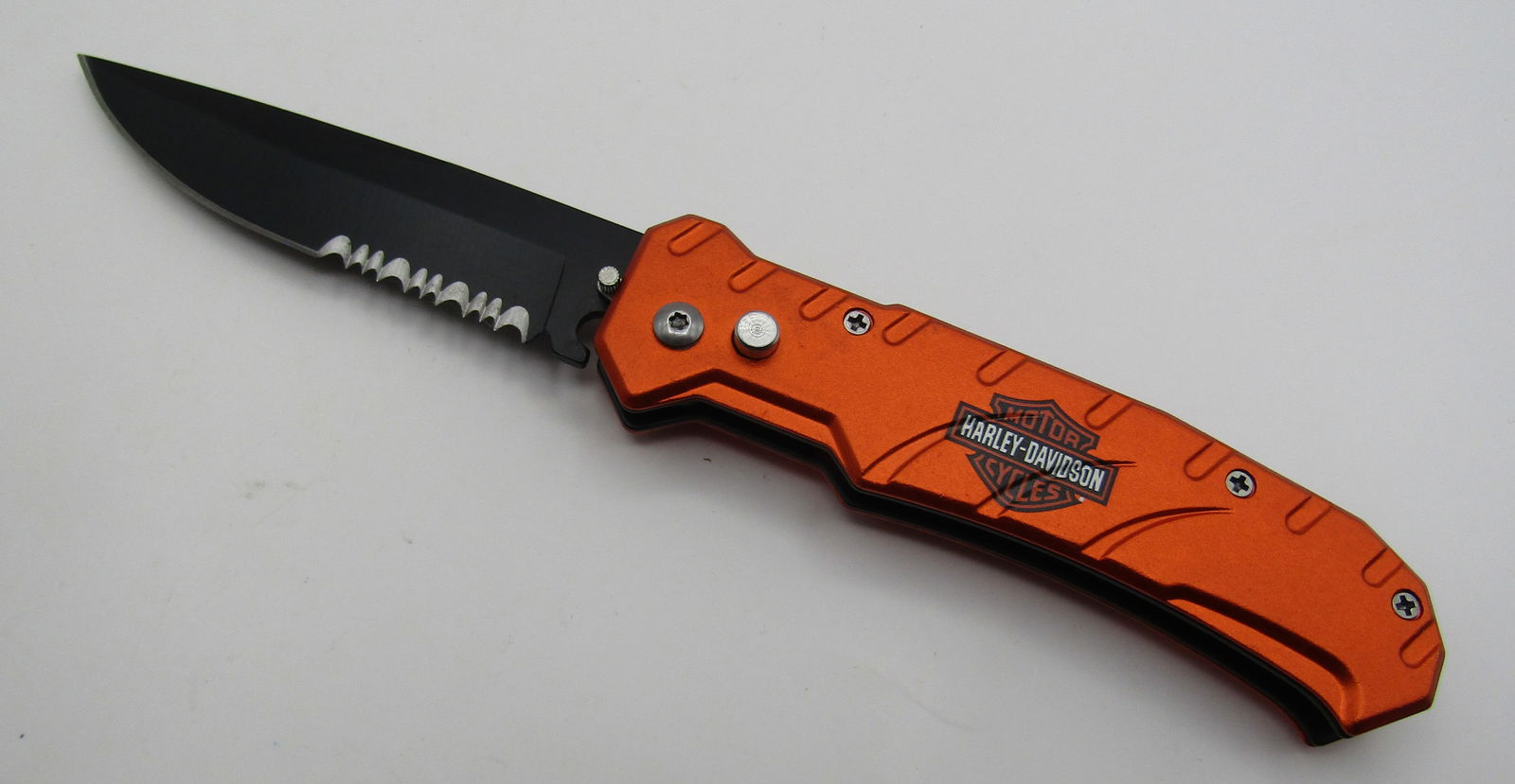 HARLEY DAVIDSON SWITHBLADE KNIFE: PUSH BUTTON SWITCHBLADE KNIFE. 8 INCH WITH 3 1/2 INCH BLADE. WITH IMPERIAL AUCTION THE COST FOR PACKING AND SHIPPING VIA USPS IN THE USA IS $5.