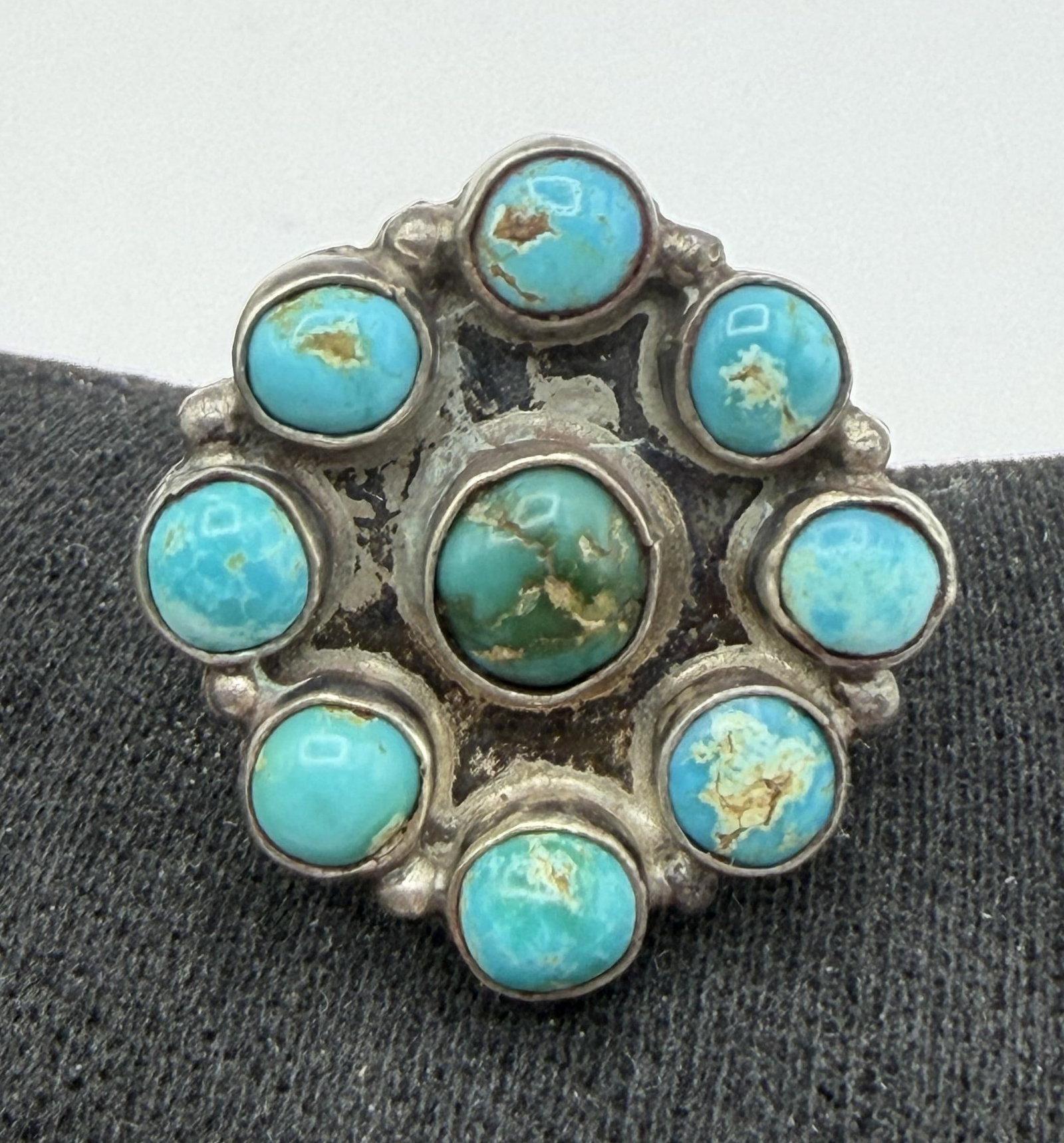 OLD PAWN STERLING SILVER TURQUOISE CLUSTER RING: NATIVE AMERICAN PETIT POINT TURQUOISE CLUSTER RING. UNMARKED UNSIGNED TESTED STERLING SILVER. FACE OF RING MEASURES JUST UNDER 1" NORTH SOUTH. WEIGHS 7.3 GRAMS. RING SIZE 8.5. WITH IMPERIAL AUCTION TH