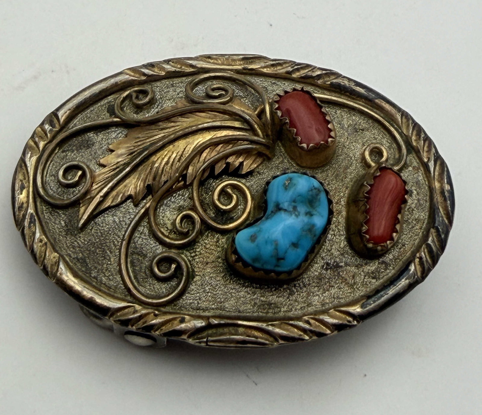 GOLD STERLING TURQUOISE RED CORAL BELT BUCKLE: NATIVE AMERICAN HANDMADE GOLD-FILLED STERLING BELT BUCKLE. MARKED TESTED "1/20 12K GF STERLING" SILVER. MEASURES 2-1/" X 1-1/2" AND FITS 1" LEATHER. WEIGHS 17.6 GRAMS. WITH IMPERIAL AUCTION THE COST F