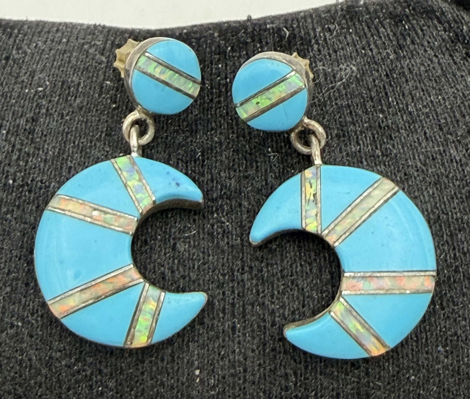 ZUNI STERLING SILVER TURQUOISE OPAL MOON EARRINGS: NATIVE AMERICAN HANDMADE EARRINGS. NEAR VINTAGE UNIQUE DESIGN. TESTED STERLING SILVER. MEASURES 1-1/8" WITH DROP. WEIGHS 5.2 GRAMS. WITH IMPERIAL AUCTION THE COST FOR PACKING AND SHIPPING VIA USPS IN 