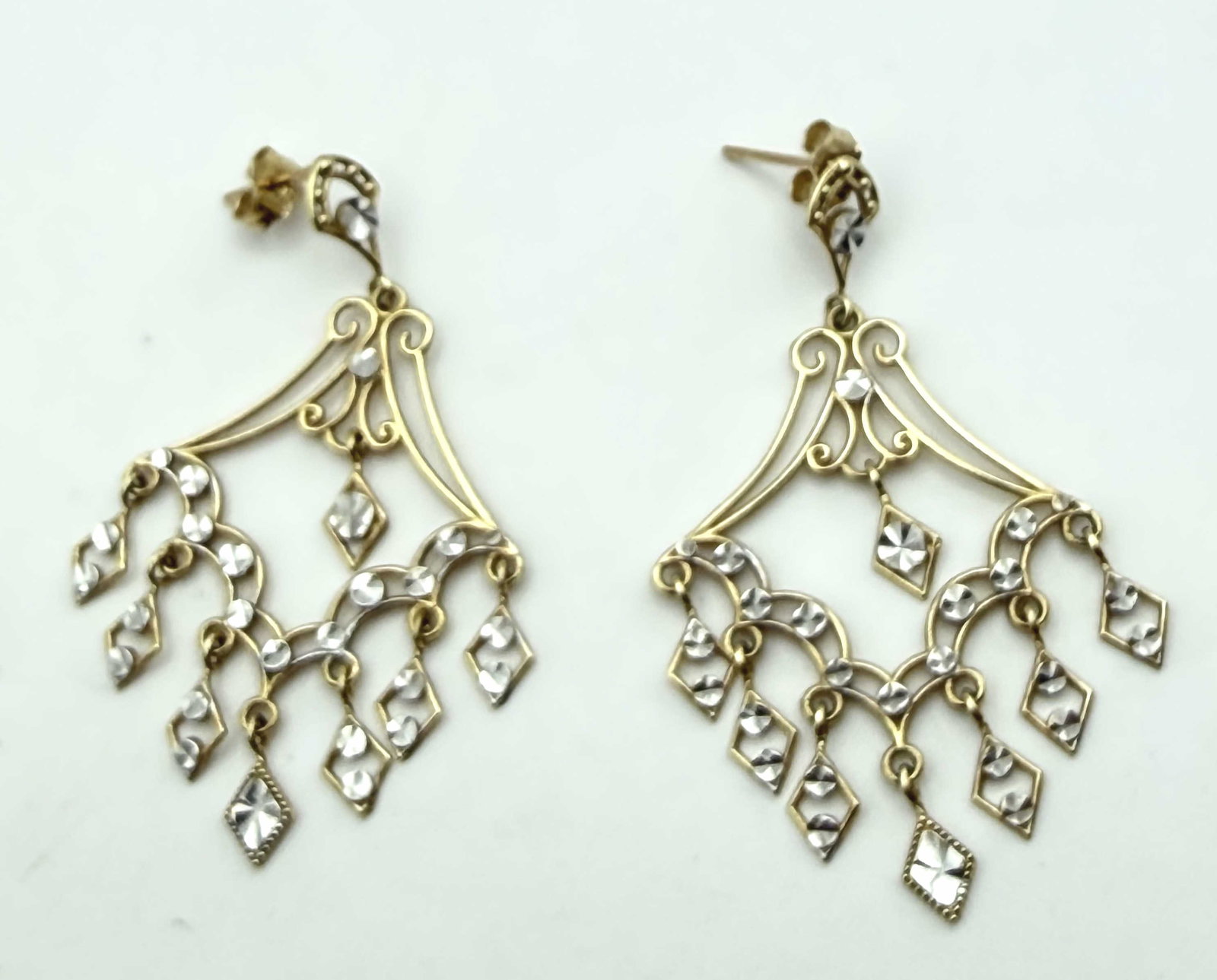 LARGE 14K SOLID GOLD LAVALIER CHANDELIER EARRINGS: WOW LARGE 2" WATERFALL CHANDELIER EARRINGS TESTED 14K SOLID GOLD. DIAMOND CUT WHITE GOLD. WEIGHS 5.0 GRAMS. MEASURES 2" X 3". WITH IMPERIAL AUCTION THE COST FOR PACKING AND SHIPPING VIA USPS IN THE