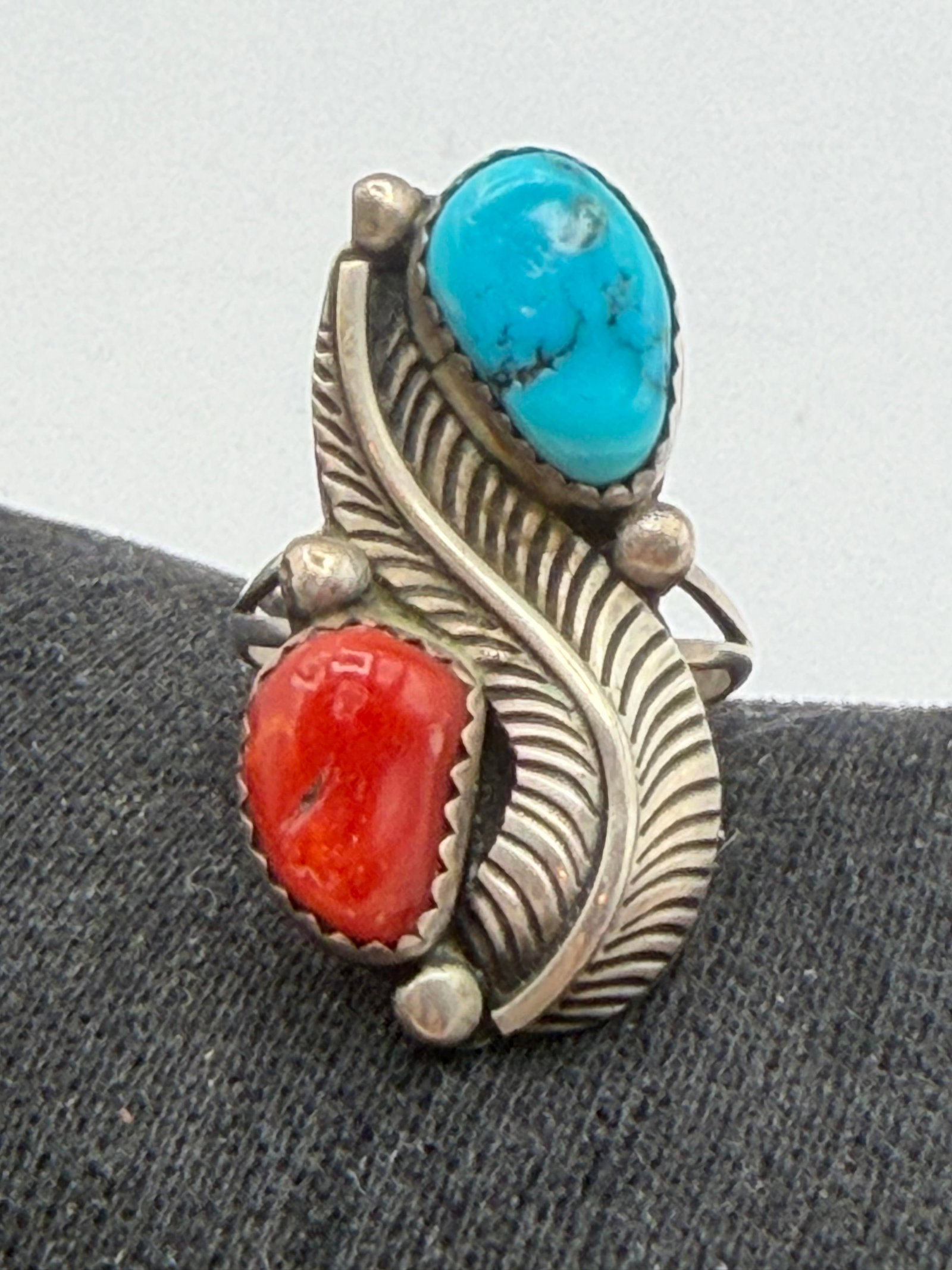 "FW" STERLING NAVAJO TURQUOISE RED CORAL RING: VINTAGE NATIVE AMERICAN HANDMADE SIGNED "FW" FRED WEEKOTY. TESTED STERLING SILVER. FACE OF RING IS 1-1/8". WEIGHS 5.1 GRAMS. RING SIZE 6.5. WITH IMPERIAL AUCTION THE COST FOR PACKING AND SHIPPING VIA 