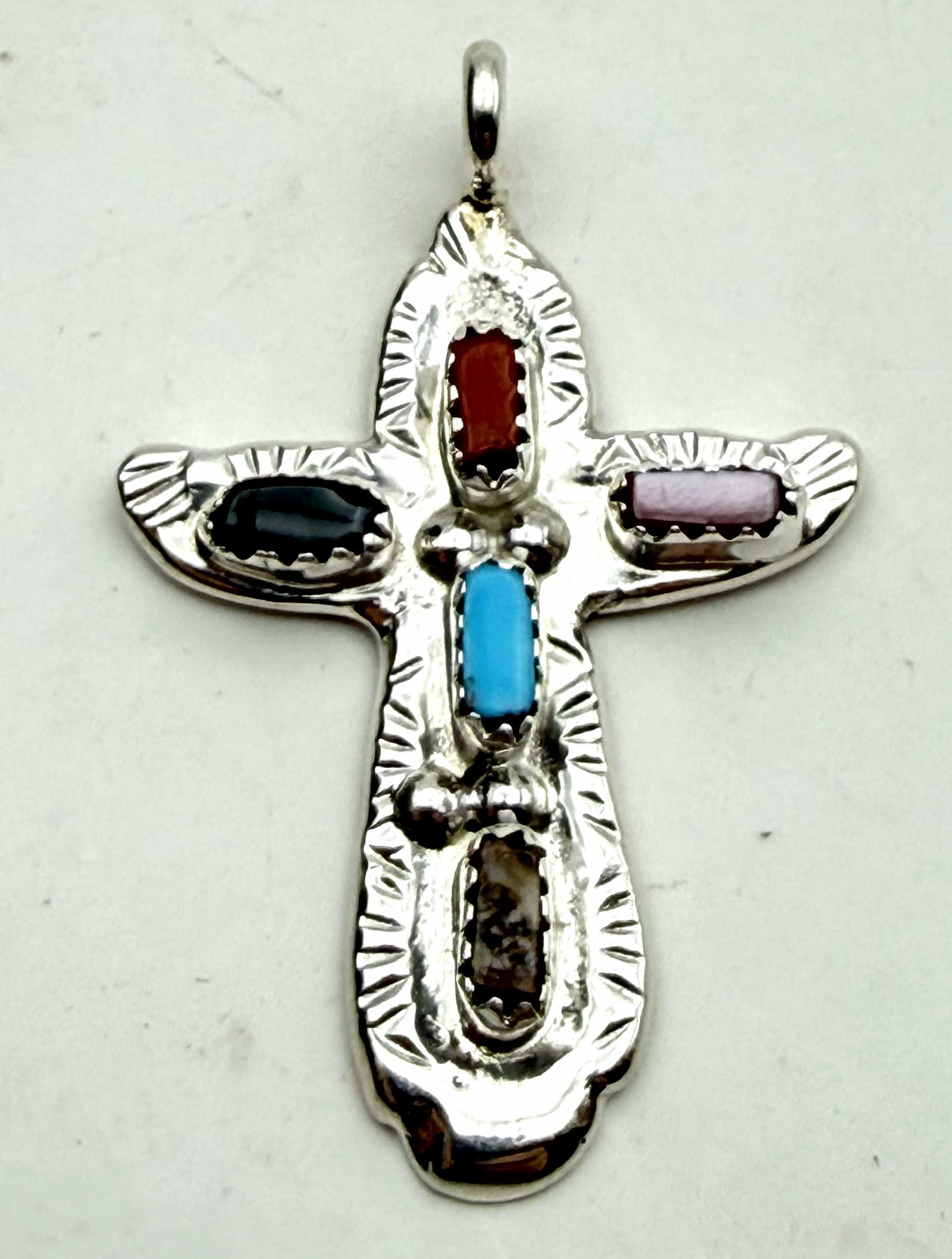 CECILIA IULE ZUNI STERLING TURQUOISE CROSS PENDANT: NEW OLD STOCK NATIVE AMERICAN HANDMADE TURQUOISE CROSS PENDANT. VARIOUS MULTICOLOR STONES. SIGNED "C IULE" MARKED TESTED STERLING SILVER. PENDANT IS 1-5/8" X 1-1/8". WEIGHS 6 GRAMS. WITH IMPERIAL