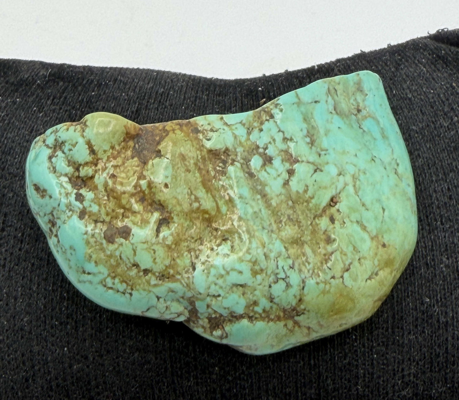 22g SONORAN GOLD TURQUOISE STONE SPECIMEN: CUT TUMBLED AND POLISHED TURQUOISE NUGGET FROM THE SONORAN GOLD MINE. NICE GREEN AND BLUE MATRIX. MEASURES 1.75" X 1" X 0.5" WEIGHS 22 GRAMS OR 110 CARATS. WITH IMPERIAL AUCTION THE COST FOR PACKING