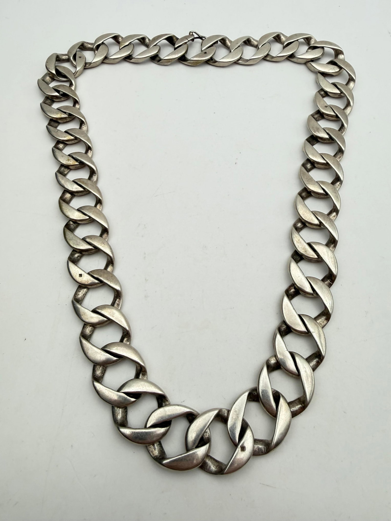 230 GRAM 19MM LARGE STERLING CURB CHAIN NECKLACE: UNKNOWN ASIAN OR SANSKRIT STAMPS HALLMARKS. MEASURES 23" AND 19MM WIDE. HUGE BIKER CHAIN LINK NECKLACE WEIGHS 230 GRAMS. WITH IMPERIAL AUCTION THE COST FOR PACKING AND SHIPPING VIA USPS IN THE USA IS