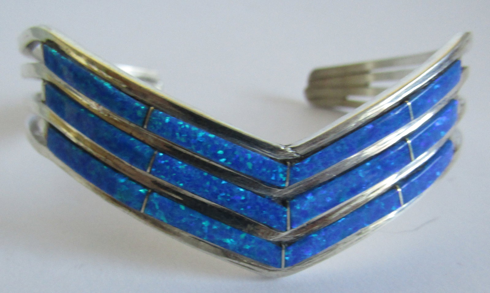 "JOHNSON" BLUE OPAL CUFF BRACELET STERLING SILVER: ARTIST HALLMARKED "JAMIE J" BRACELET NATIVE AMERICAN SOUTHWEST NAVAJO INDIAN JEWELRY. MEASURES 1 INCH WIDE. FITS A 7 INCH WRIST WITH A 1 INCH GAP. TESTED STERLING SILVER. WEIGHS 18.7 GRAMS. EXCELLENT 