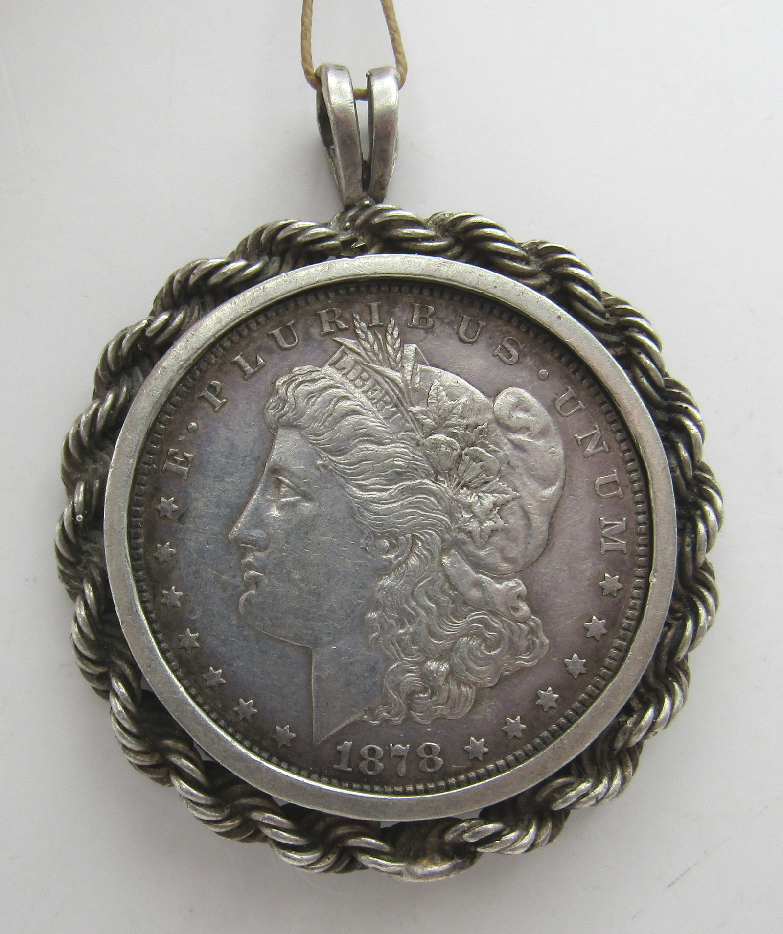 1878 S US SILVER DOLLAR COIN NECKLACE PENDANT 43GR: GENUINE VINTAGE ESTATE TESTED STERLING SILVER FRAME. MEASURES 2.25" BY 2". WEIGHS 43.0 GRAMS. EXCELLENT CONDITION. WITH IMPERIAL AUCTION THE COST FOR PACKING AND SHIPPING VIA USPS IN THE USA IS $5.