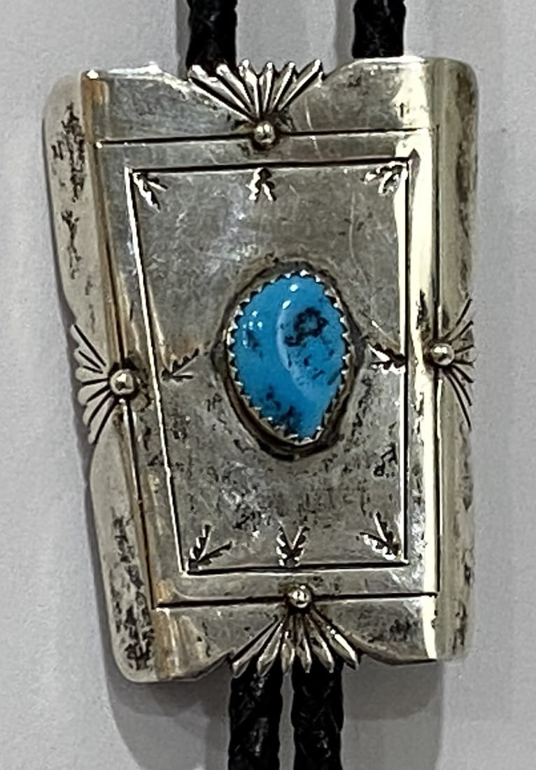 "RI" TURQUOISE BOLO TIE NECKLACE STERLING SILVER: ARTIST HALLMARKED "RI STERLING". 38 INCH LONG VINTAGE ESTATE GENUINE TURQUOISE STERLING SILVER AND BRAIDED LEATHER NECKLACE. NATIVE AMERICAN SOUTHWEST NAVAJO INDIAN JEWELRY. BOLO MEASURES 2 INCHES BY 