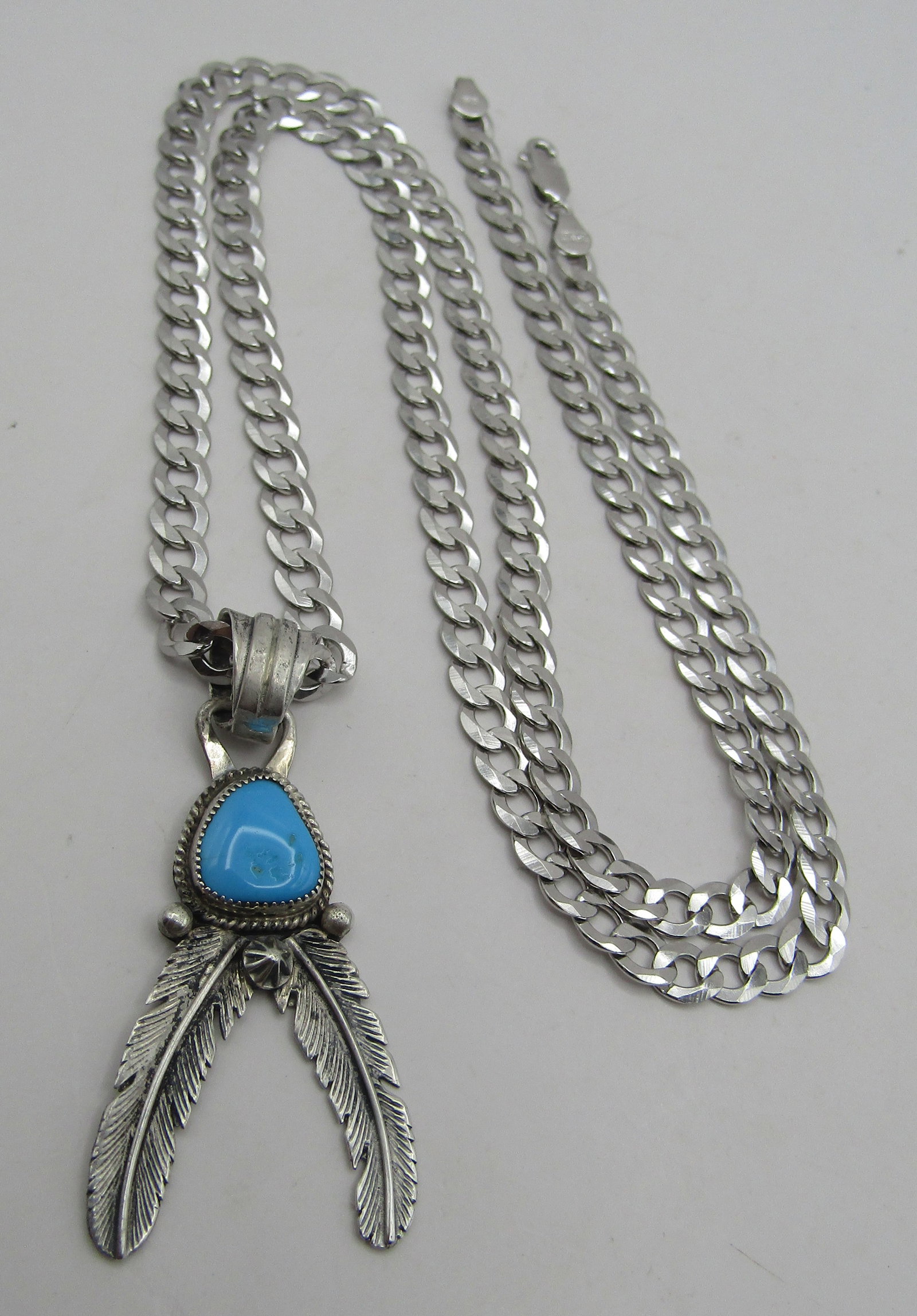 SLEEPING BEAUTY TURQUOISE NECKLACE STERLING 29GRM: VINTAGE ESTATE GENUINE TURQUOISE NATIVE AMERICAN SOUTHWEST NAVAJO INDIAN JEWELRY HALLMARKED "RB". STERLING SILVER PENDANT MEASURES 2 INCHES. PLUS A 25 INCH STERLING SILVER CURB CHAIN MARKED "ITALY 925