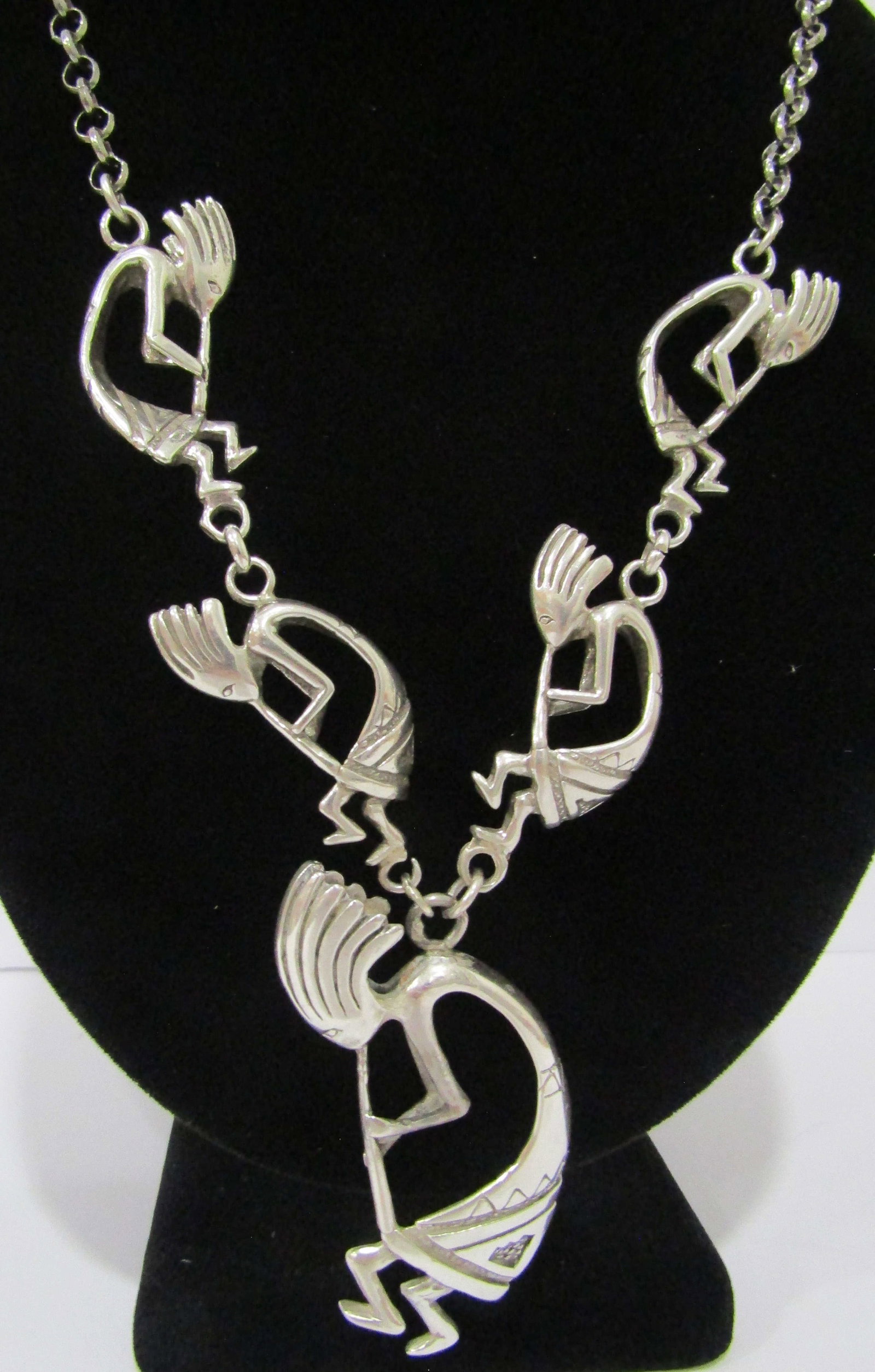 "A" 26" KOKOPELLI NECKLACE STERLING SILVER 73GRAM: ARTIST HALLMARKED "A STERLING" SILVER NATIVE AMERICAN SOUTHWEST INDIAN NAVAJO JEWELRY. MEASURES 26 INCHES LONG PLUS 2.5" DROP. WEIGHS 73.3 GRAMS. EXCELLENT CONDITION. WITH IMPERIAL AUCTION THE COST FO
