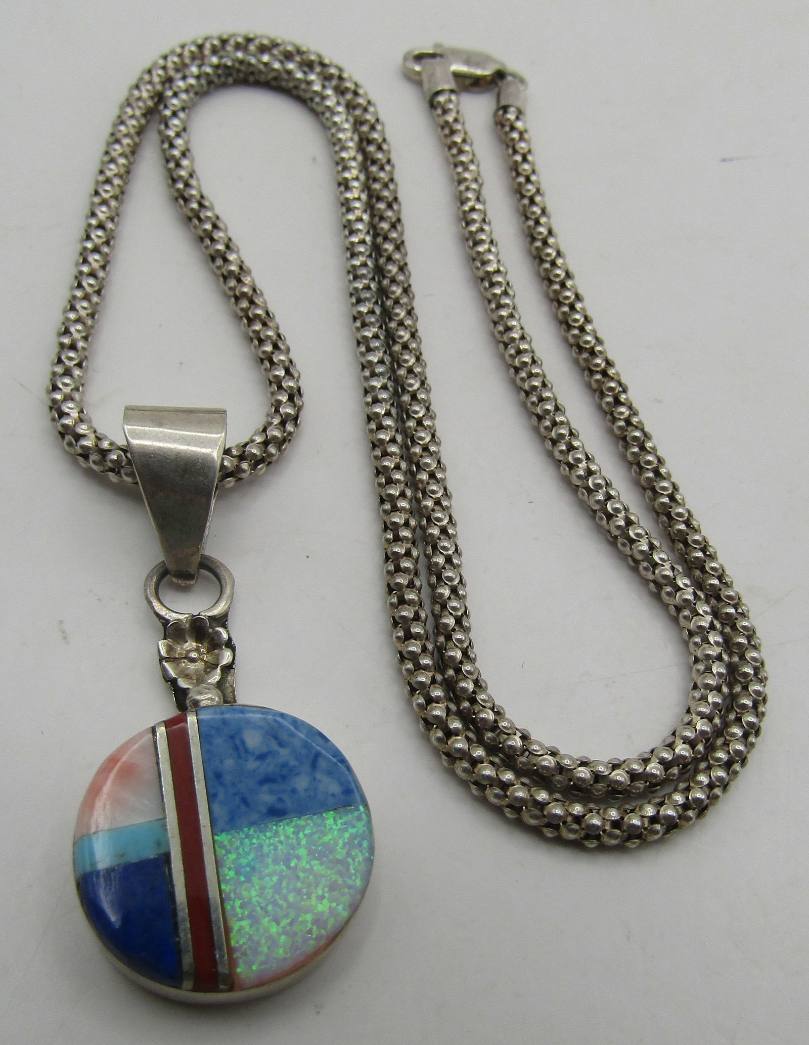 "W" INLAY NECKLACE STERLING SILVER TURQUOISE LAPIS: INLAID WITH ASSORTED STONES: SPINY OYSTER SHELL, TURQUOISE, RED CORAL, OPAL, LAPIS; VINTAGE ESTATE ARTIST HALLMARKED "W STERLING" NECKLACE. NATIVE AMERICAN SOUTHWEST ZUNI / NAVAJO INDIAN JEWELRY. PEND