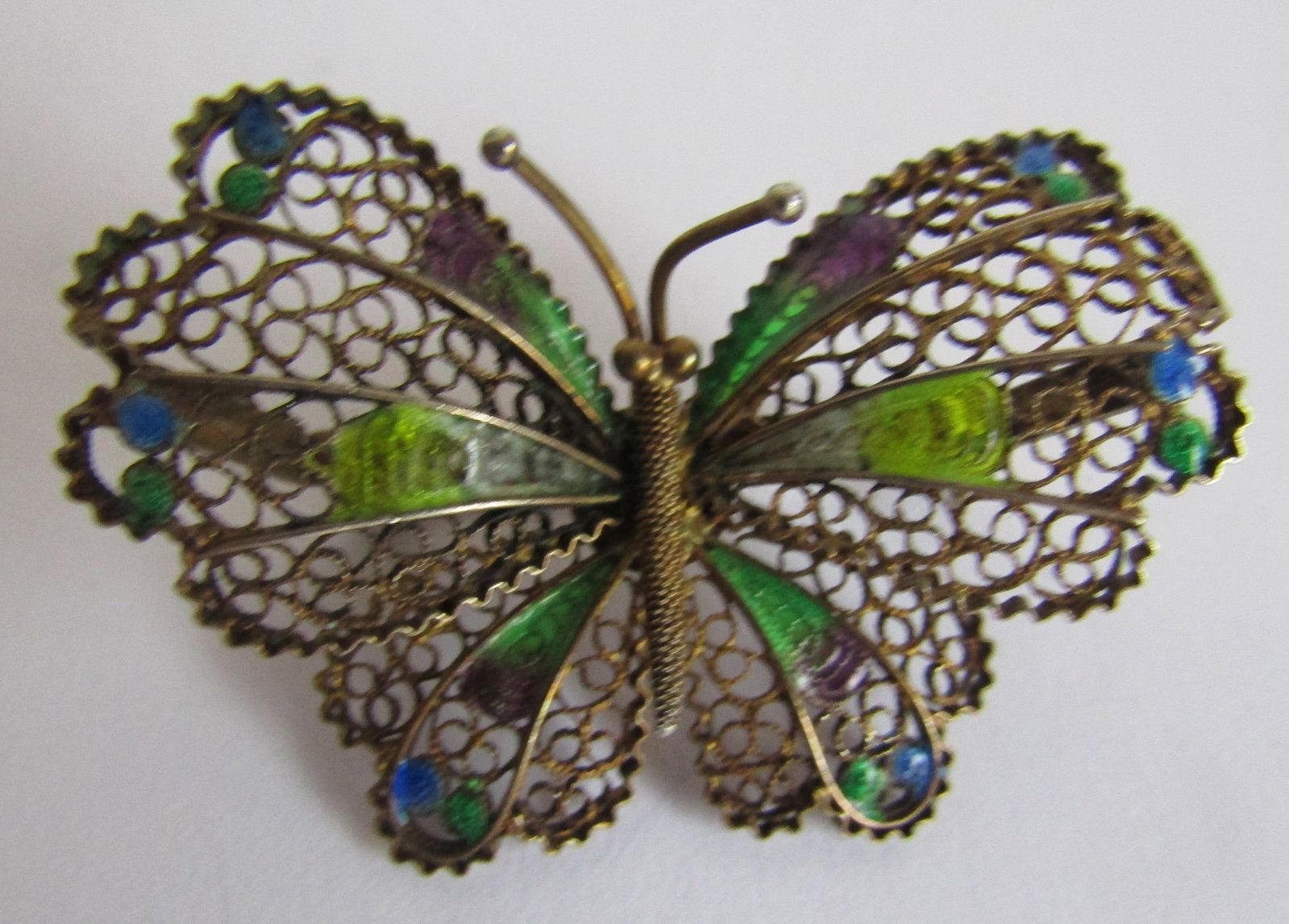 STERLING SILVER FILIGREE BUTTERFLY ENAMEL PIN: ANTIQUE HANDCRAFTED FILIGREE WORK WITH GOLD WASH BUTTERFLY PIN. MEASURES 1.75 INCHES WIDE. WEIGHS 6.0 GRAMS; MARKED 800 WITH A HALLMARK (PLEASE SEE PHOTOS). EXCELLENT ANTIQUE CONDITION. WITH IMPERIAL 
