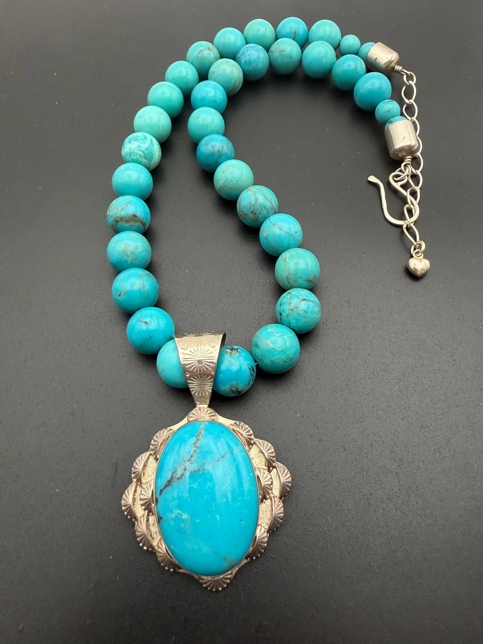 DESERT ROSE TRADING STERLING TURQUOISE NECKLACE: LARGE 92 GRAM GENUINE TURQUOISE BEADED NECKLACE WITH STERLING TURQUOISE PENDANT. BOTH SIGNED DTR FOR DESERT ROSE TRADING. TESTED STERLING SILVER. MEASURES UP TO 20.5" ADJUSTABLE. BEADS ARE 0.5". PENDA