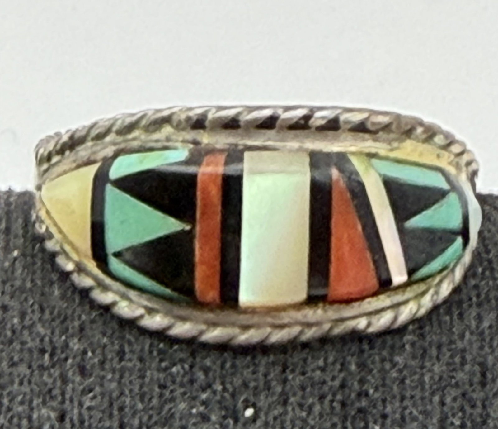 T WEEBOTHEE ZUNI STERLING TURQUOISE RING: VINTAGE NATIVE AMERICAN HANDMADE RING. SIGNED TESTED STERLING SILVER. INLAID TURQUOISE RED CORAL ONYX AND MOTHER OF PEARL SHELL. FACE OF RING IS 3/8" TALL. WEIGHS 3.3 GRAMS TOTAL. RING SIZE 9. WITH IM