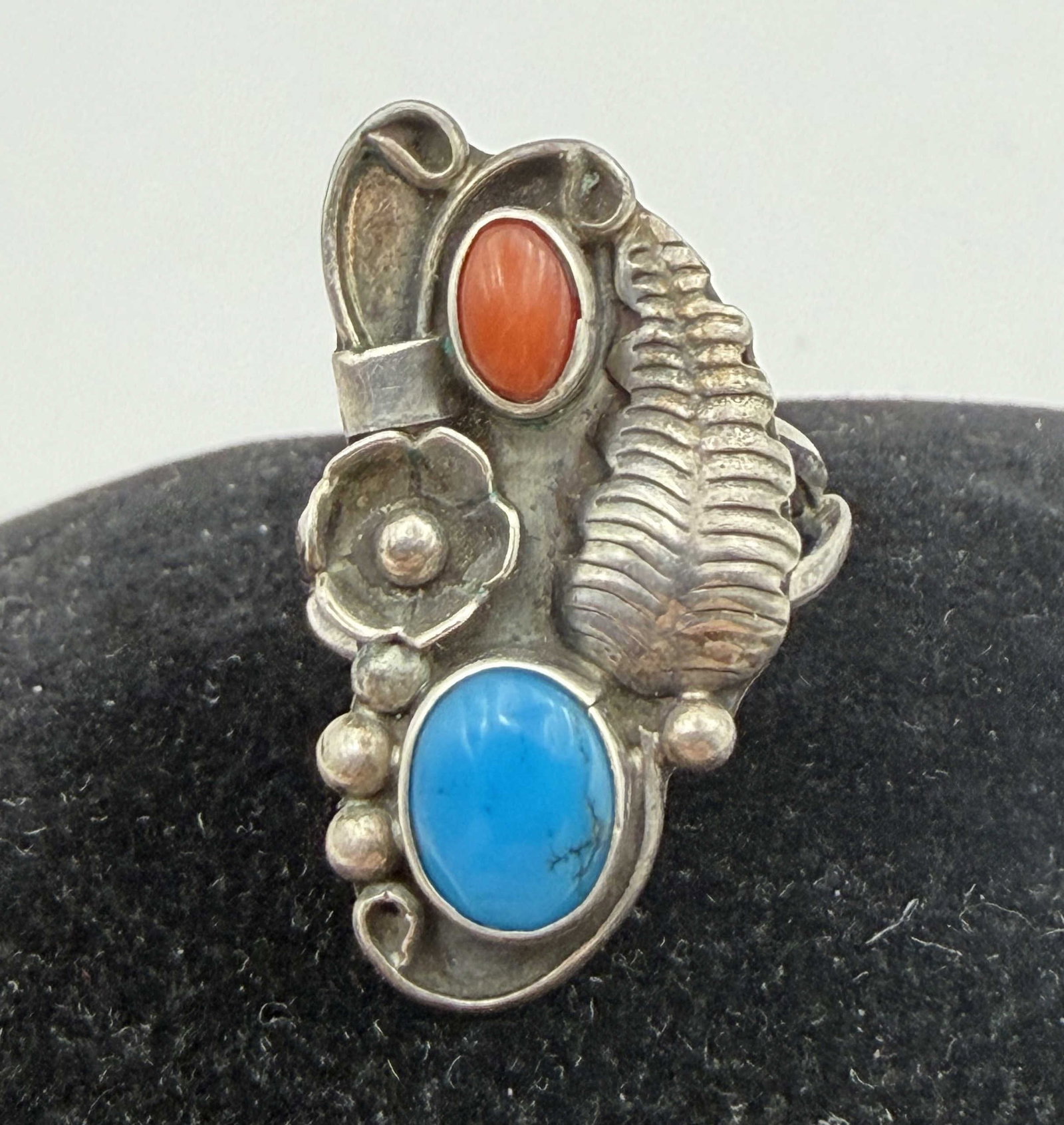 "S" STERLING NAVAJO TURQUOISE RED CORAL RING: VINTAGE NATIVE AMERICAN HANDMADE RING. SIGNED "S". MARKED TESTED STERLING SILVER. MEASURES 1" TALL. WEIGHS 4.3 GRAMS. RING SIZE 5.5. WITH IMPERIAL AUCTION THE COST FOR PACKING AND SHIPPING VIA USPS IN