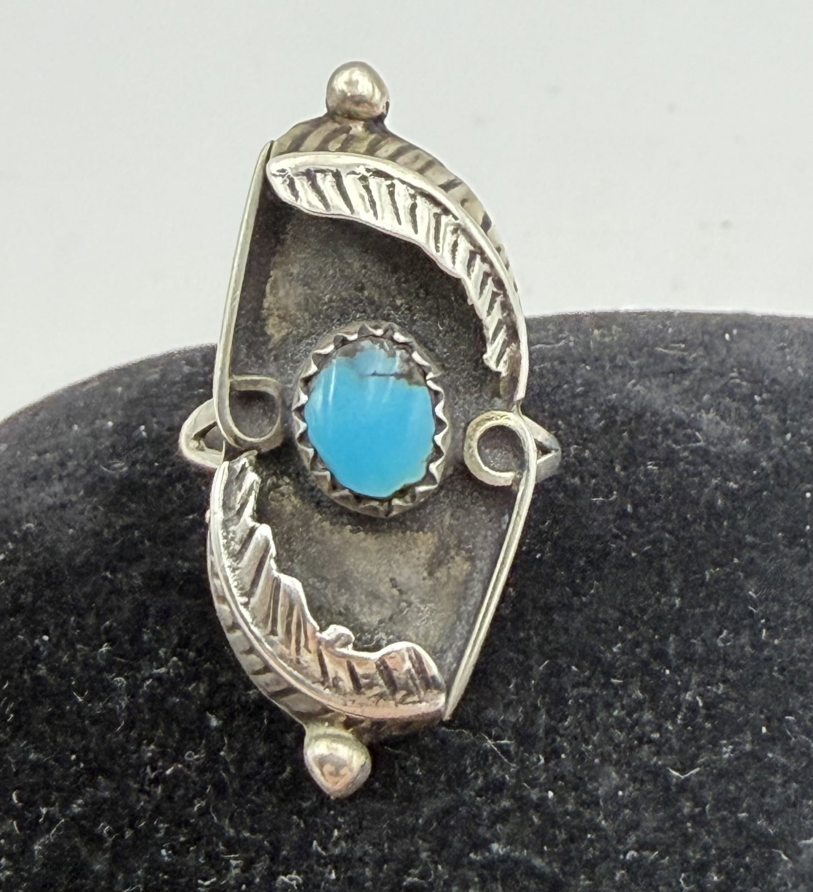 STERLING TURQUOISE SHADOWBOX RING: VINTAGE NATIVE AMERICAN HANDMADE RING. UNSIGNED UNMARKED TESTED STERLING SILVER. MEASURES 1.25" TALL. WEIGHS 3.6 GRAMS. RING SIZE 5.5. WITH IMPERIAL AUCTION THE COST FOR PACKING AND SHIPPING VIA USPS 