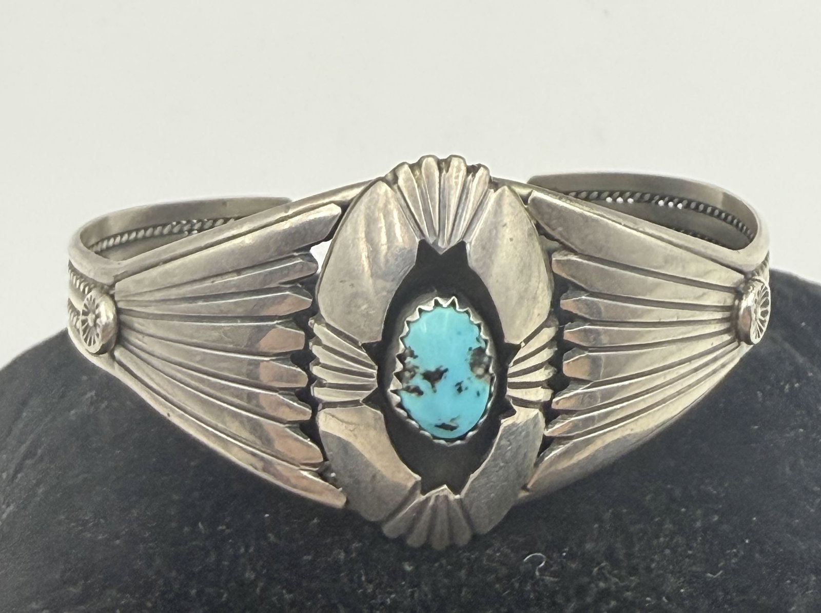 CECIL SANDERS NAVAJO STERLING TURQUOISE BRACELET: CECIL SANDERS NATIVE AMERICAN NAVAJO HANDMADE SHADOWBOX CUFF BRACELET. MARKED SIGNED "CS" TESTED STERLING SILVER. FACE IS 1-1/8". GAP IS 1-1/2" FLEXIBLE AND FITS 7-1/4" WRIST. WEIGHS 15 GRAMS. WITH IM