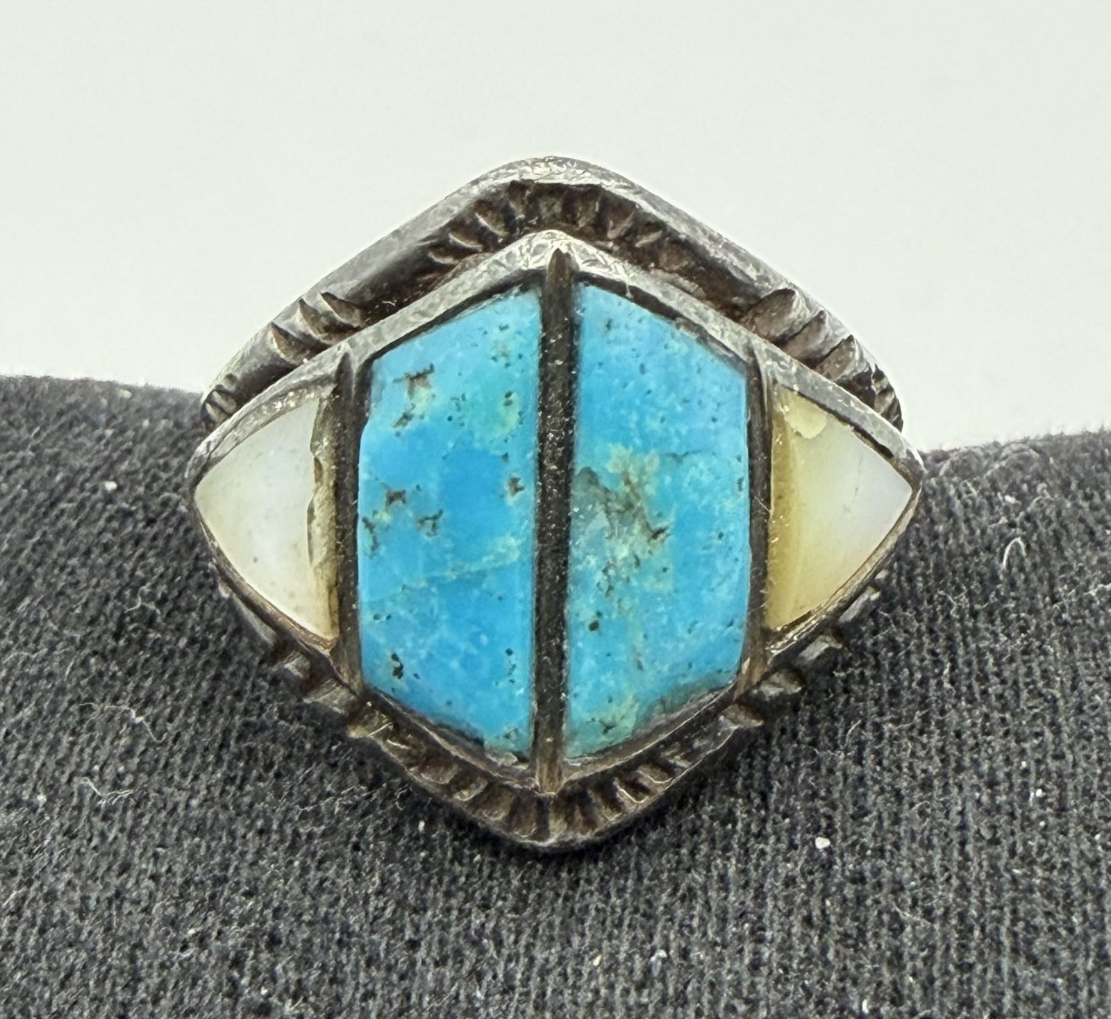 OLD PAWN STERLING TURQUOISE NATIVE AMERICAN RING: VINTAGE NATIVE AMERICAN HANDMADE INLAID MOTHER OF PEARL AND TURQUOISE RING. UNKNOWN HALLMARK. TESTED STERLING SILVER. FACE OF RING IS 0.75" NORTH SOUTH. RING SIZE 5. WEIGHS 7.6 GRAMS. WITH IMPERIAL AU