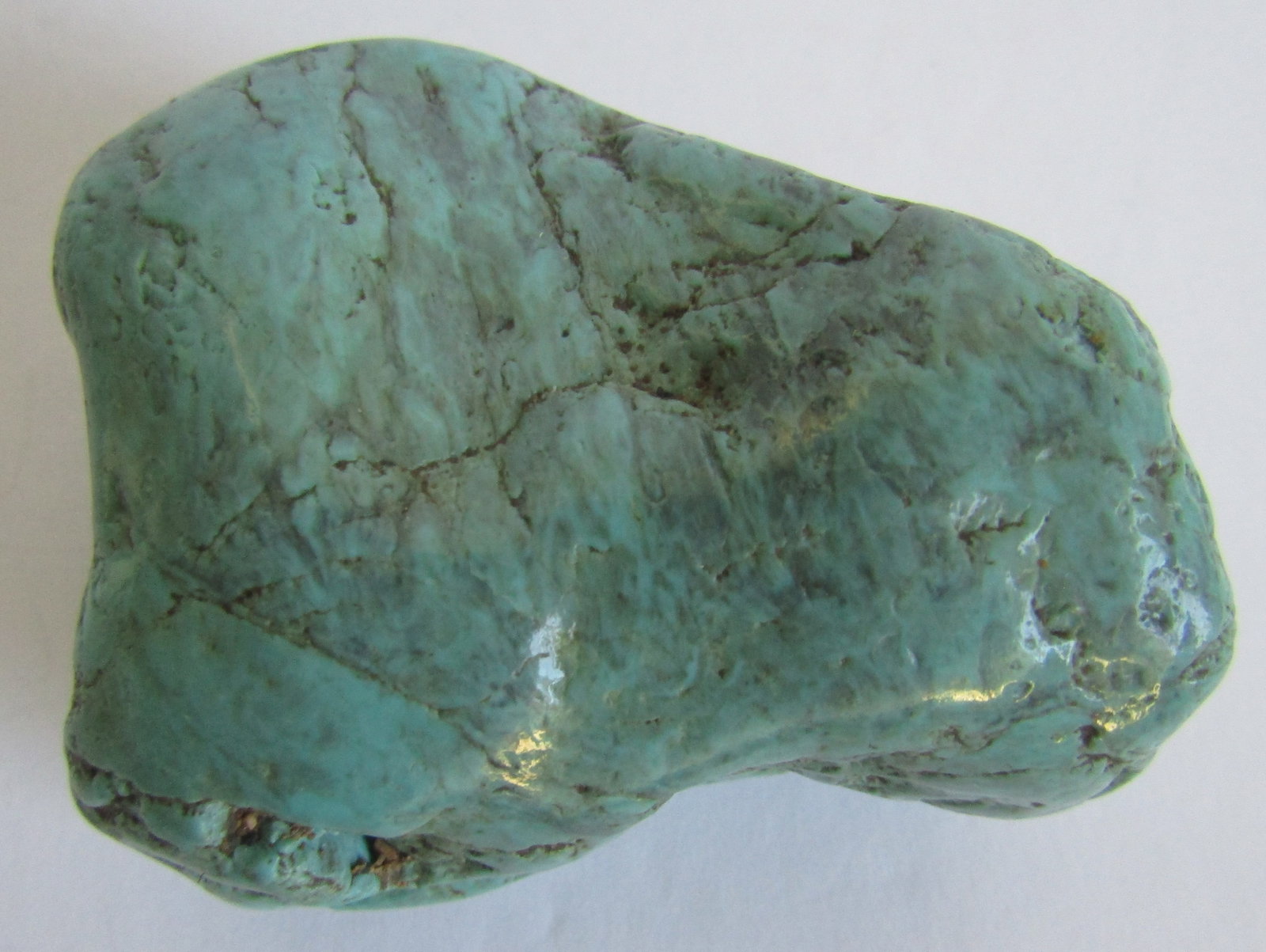 114 GRAM TURQUOISE NUGGET STONE SPECIMEN: 2 1/2 BY 2 INCH AND 1 1/8 INCH THICK. WEIGHS 114 GRAMS. USA SHIPPING USPS $5