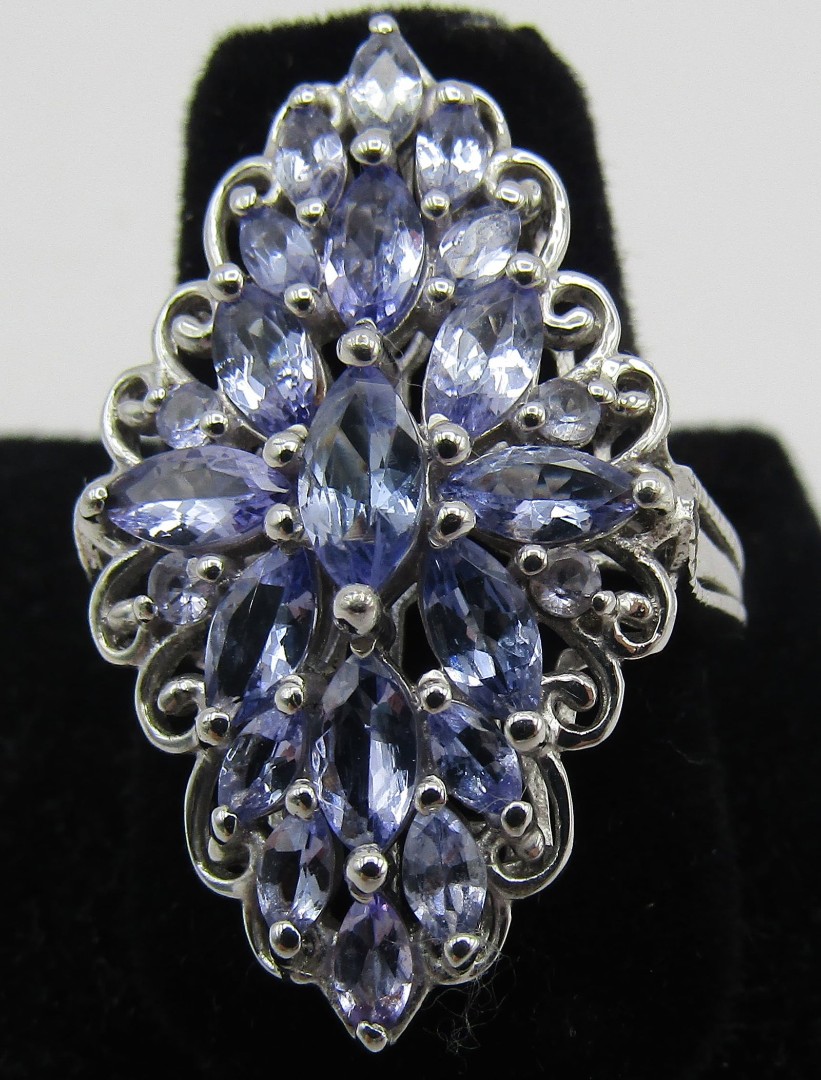 2CT TANZANITE RING STERLING SILVER SIZE 8: SIZE 8. GENUINE VINTAGE ESTATE 2 CARAT MARQUISE BLUE TANZANITE GEMSTONE RING MARKED "925" STERLING SILVER. WEIGHS 6.4 GRAMS. EXCELLENT CONDITION. WITH IMPERIAL AUCTION THE COST FOR PACKING AND SHIPPIN