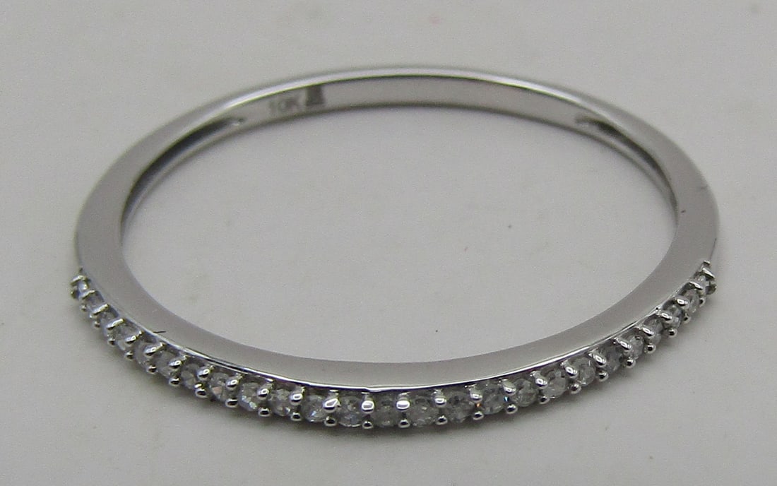 23 NATURAL DIAMOND BAND RING 10K WHITE GOLD SIZE 7: 23 GENUINE NATURAL DIAMONDS. MOUNTED IN 10K WHITE GOLD MOUNTING. SIZE 7. WEIGHS .8 GRAM, EXCELLENT, NEW CONDITION. WITH IMPERIAL AUCTION THE COST FOR PACKING AND SHIPPING VIA USPS IN THE USA IS $5.