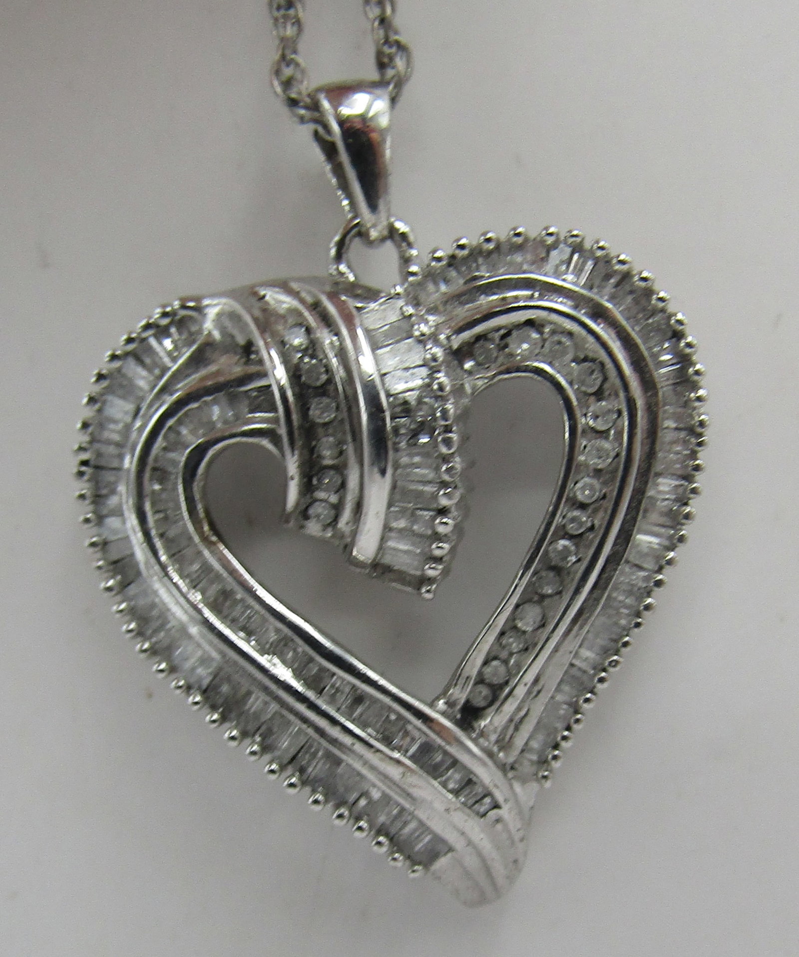 2CT DIAMOND HEART 18" NECKLACE STERLING SILVER: GENUINE VINTAGE ESTATE MARKED "925 JWBR" NECKLACE HEART. LINK CHAIN MEASURES 18 INCHES LONG PLUS 1.25" HEART. WEIGHS 7.6 GRAMS. EXCELLENT CONDITION. WITH IMPERIAL AUCTION THE COST FOR PACKING AND SHIP