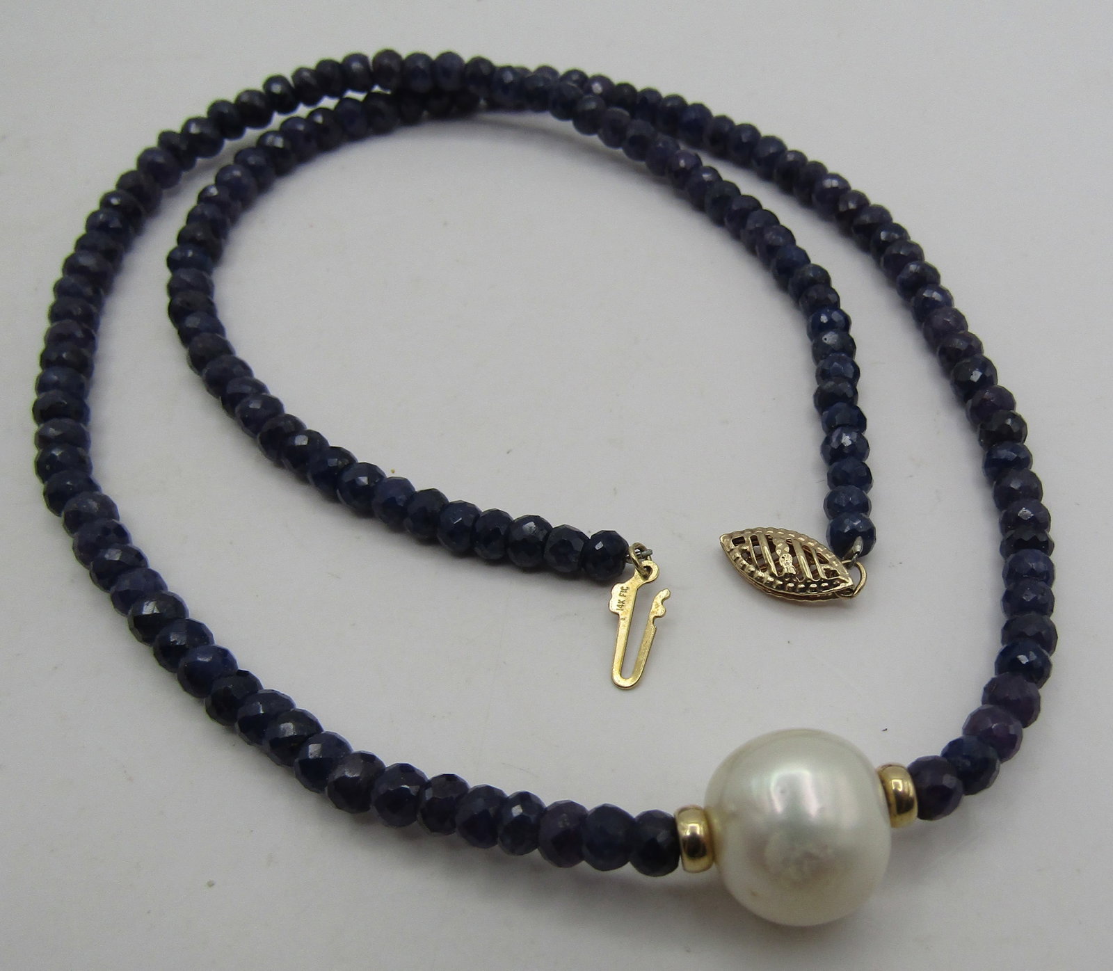 18" 14K GOLD SAPPHIRE BEAD & 12MM PEARL NECKLACE: GENUINE VINTAGE ESTATE MARKED "14K"4MM SAPPHIRE BEAD &12MM PEARL NECKLACE. MEASURES 18 INCHES LONG. WEIGHS 19.5 GRAMS. EXCELLENT CONDITION. WITH IMPERIAL AUCTION THE COST FOR PACKING AND SHIPPING VIA 