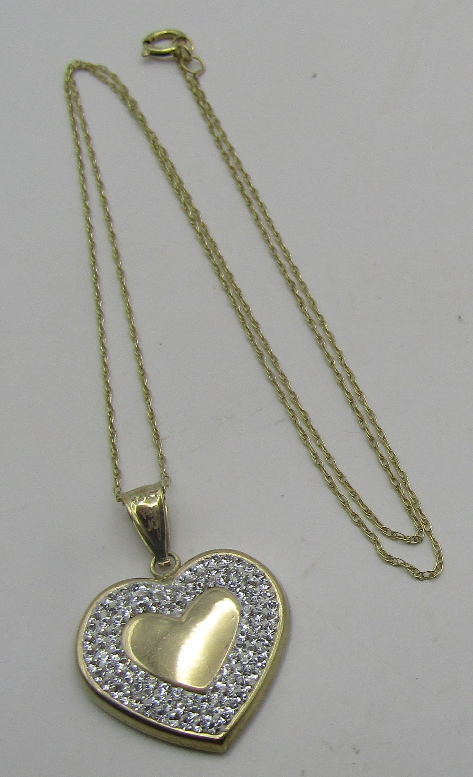 14K GOLD CHAIN & HEART PENDANT 18" NECKLACE 2.2GR: GENUINE VINTAGE ESTATE MARKED "14K" NECKLACE. MEASURES 18 INCHES LONG PLUS 1 INCH PENDANT. WEIGHS 2.2 GRAMS. EXCELLENT CONDITION. WITH IMPERIAL AUCTION THE COST FOR PACKING AND SHIPPING VIA USPS IN TH