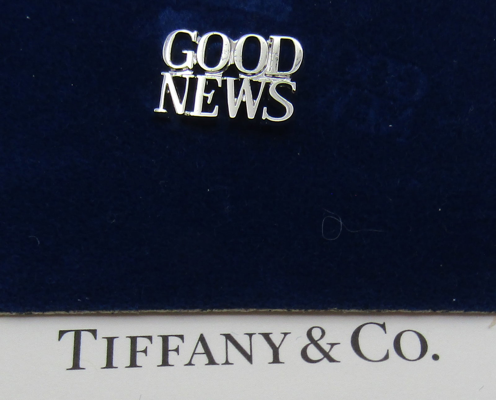 TIFFANY & CO GOOD NEWS STERLING SILVER PIN TIE TAC: A BABY, A WEDDING, A JOB, RETIREMENT..... SO MANY WAYS TO SHARE GOOD NEWS. GENUINE SIGNED TIFFANY & CO. PIN OR TIE TACK. MEASURES 5/8 INCH. WEIGHS 1.3 GRAMS OF STERLING SILVER. VINTAGE ESTATE, NEVER U