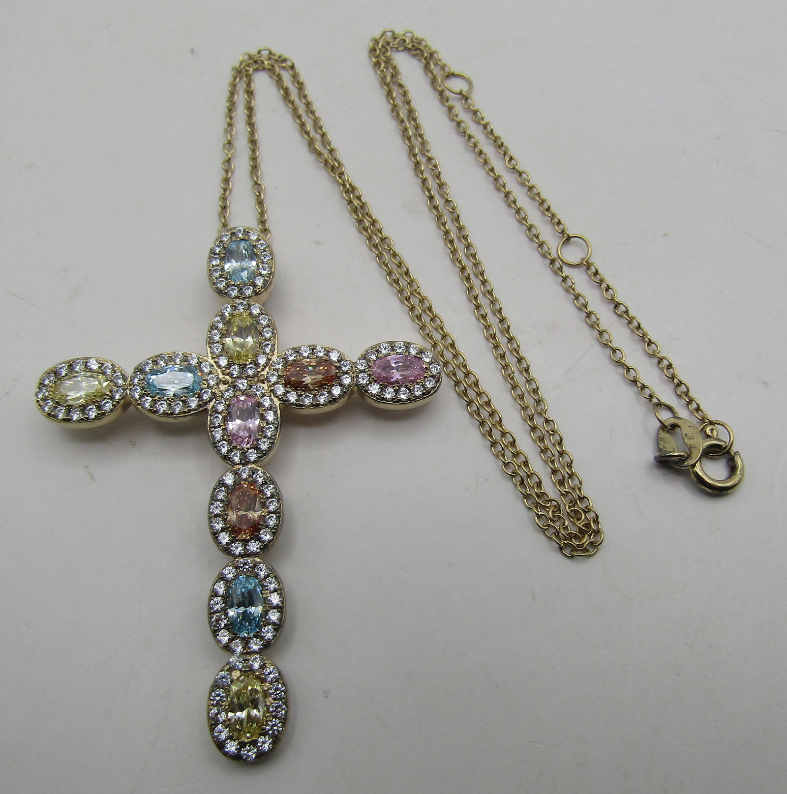 GOLD ON STERLING MULTICOLORED STONE CROSS & CHAIN: 18 INCH GOLD ON STERLING SILVER LINK CHAIN & 2 INCH CROSS PENDANT WEIGHS 7.2 GRAMS. EXCELLENT CONDITION. WITH IMPERIAL AUCTION THE COST FOR PACKING AND SHIPPING VIA USPS IN THE USA IS $5.