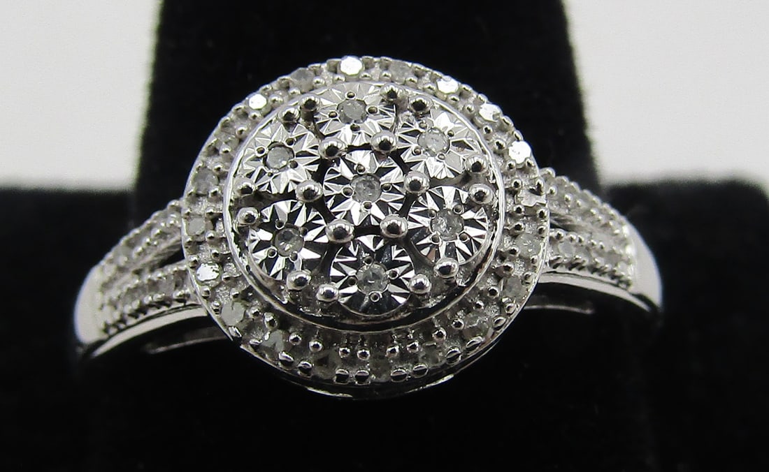 43 NATURAL DIAMOND CLUSTER RING STERLING SILVER: SIZE 7; 43 DIAMONDS MOUNTED IN STERLING SILVER. WEIGHS 2.4 GRAMS. EXCELLENT CONDITION. WITH IMPERIAL AUCTION THE COST FOR PACKING AND SHIPPING VIA USPS IN THE USA IS $5.