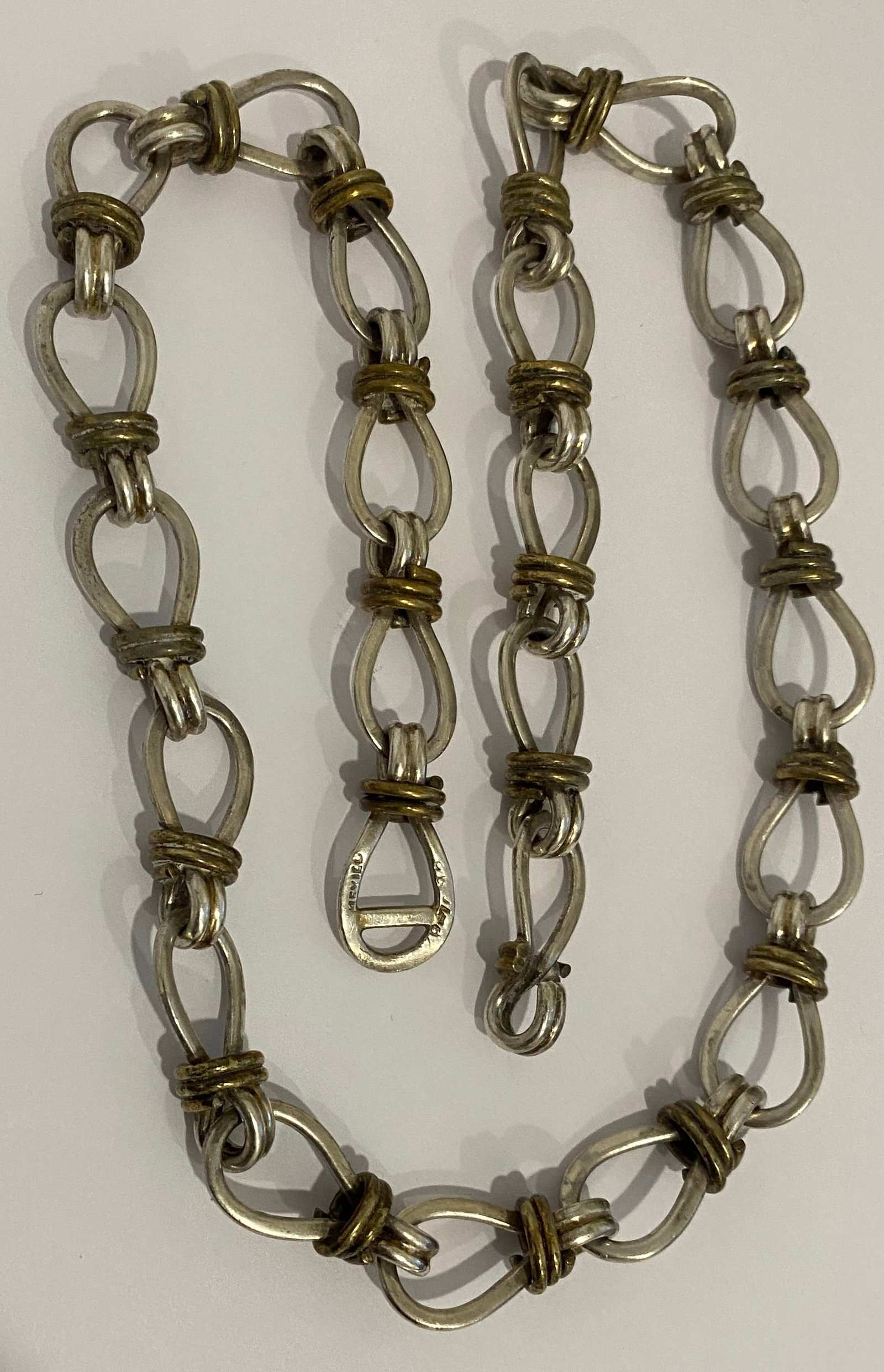 22" LINK CHAIN STERLING SILVER 87GRAM TAXCO MEXICO: MARKED "TP-7?, MEXICO 925"; A 22 INCH CHAIN NECKLACE. WEIGHS 87.5 GRAMS. EXCELLENT USED CONDITION. WITH IMPERIAL AUCTION THE COST FOR PACKING AND SHIPPING VIA USPS IN THE USA IS $5.