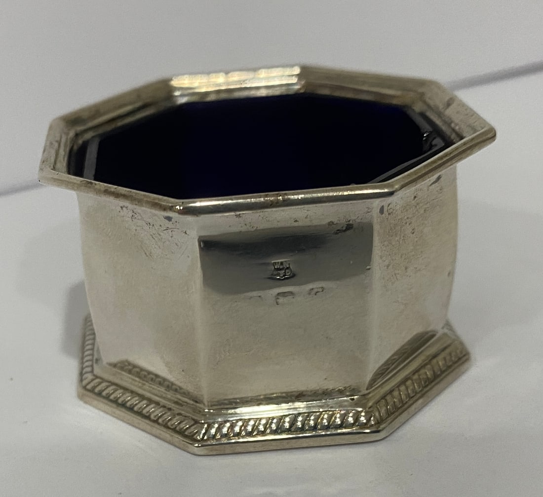 WN LTD SALT VANITY DISH STERLING SILVER COBALT: ANTIQUE BOWL HALLMARKED "W.N LTD, RD NO735485 WITH MARKS THAT ARE ILLEGIBLE. MEASURES 2.25" BY 2.25" BY 1 3/8". STERLING SILVER WEIGHS 34.0 GRAMS; WITH COLBALT GLASS 65.3 GRAMS. EXCELLENT CONDITION. W