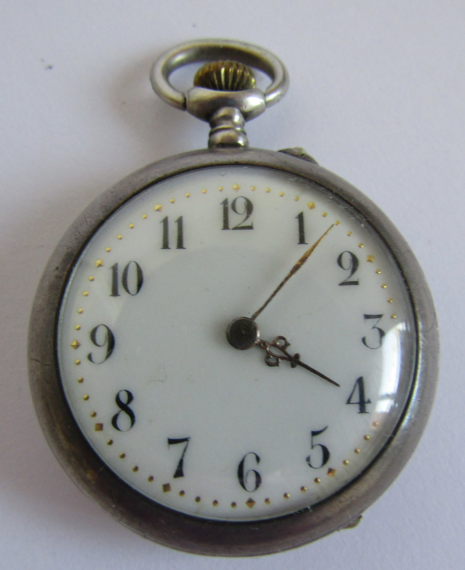 ANTIQUE STERLING SILVER POCKETWATCH R.F. MONTOIR: SMALL STERLING SWISS POCKET WATCH 10 RUBY MOVEMENT. RUNNING. PIN SET. 32 MM WIDE AND 44MM TALL. WEIGHS 22.1 GRAMS. WHITE DIAL WITH GOLD DOTS. NEEDS SERVICE. USA SHIPPING USPS$5