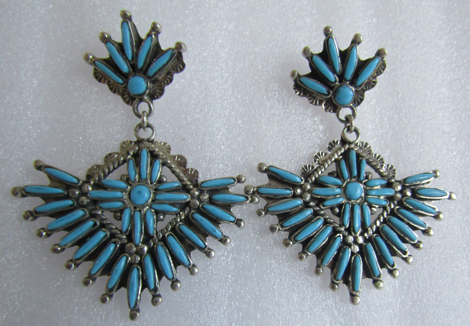 PETITPOINT TURQUOISE EARRINGS STERLING SILVER 13GR: MEASURE 2 INCHES LONG BY 1.5 INCH WIDE PETIT POINT TURQUOISE EARRINGS. MARKED "STERLING", WEIGH 13.0 GRAMS. EXCELLENT CONDITION. WITH IMPERIAL AUCTION THE COST FOR PACKING AND SHIPPING VIA USPS IN THE