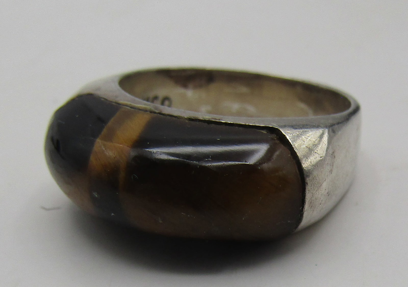 LBL TAXCO TIGER EYE RING STERLING SILVER SIZE8: VINTAGE ESTATE STERLING SILVER RING INLAID WITH TIGER EYE. SIZE 8. WEIGHS 9.3 GRAMS. MARKED "MEXICO, 925, LDL AND AN EAGLE WITH A 3 ON THE OUTSIDE OF THE BACK BAND. EXCELLENT USED CONDITION. WITH IMPE