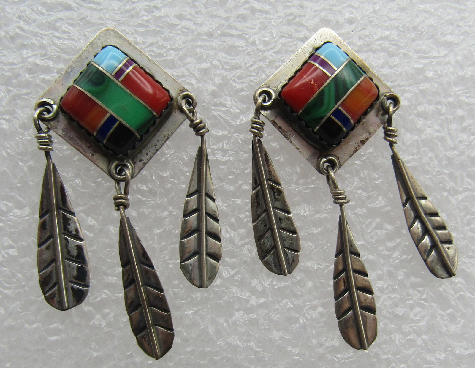 INLAY TURQUOISE CORAL SOS EARRINGS STERLING SILVER: VINTAGE ESTATE TURQUOISE, MALACHITE , CORAL, SPINY OYSTER SHELL AND OTHER GEMS. ARTIST HALLMARKED WITH A BROKEN ARROW AND "STERLING". TESTED STERLING SILVER . NATIVE AMERICAN SOUTHWEST NAVAJO INDIAN J