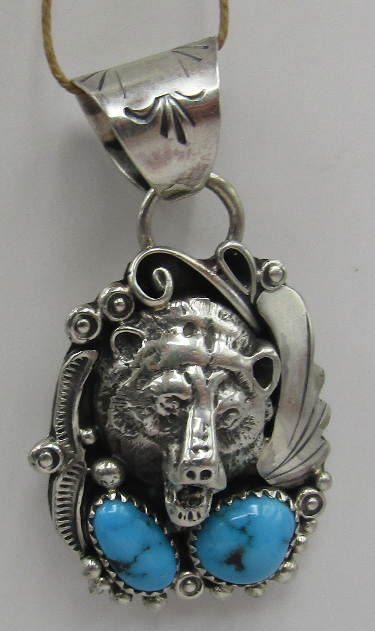 J" TURQUOISE BEAR NECKLACE PENDANT STERLING SILVER: ARTIST HALLMARKED "J STERLING" VINTAGE ESTATE GENUINE TURQUOISE BEAR PENDANT. NATIVE AMERICAN SOUTHWEST NAVAJO INDIAN JEWELRY. MEASURES 2 INCHES. TESTED STERLING SILVER. WEIGHS 13.9GRAMS. EXCELLENT US