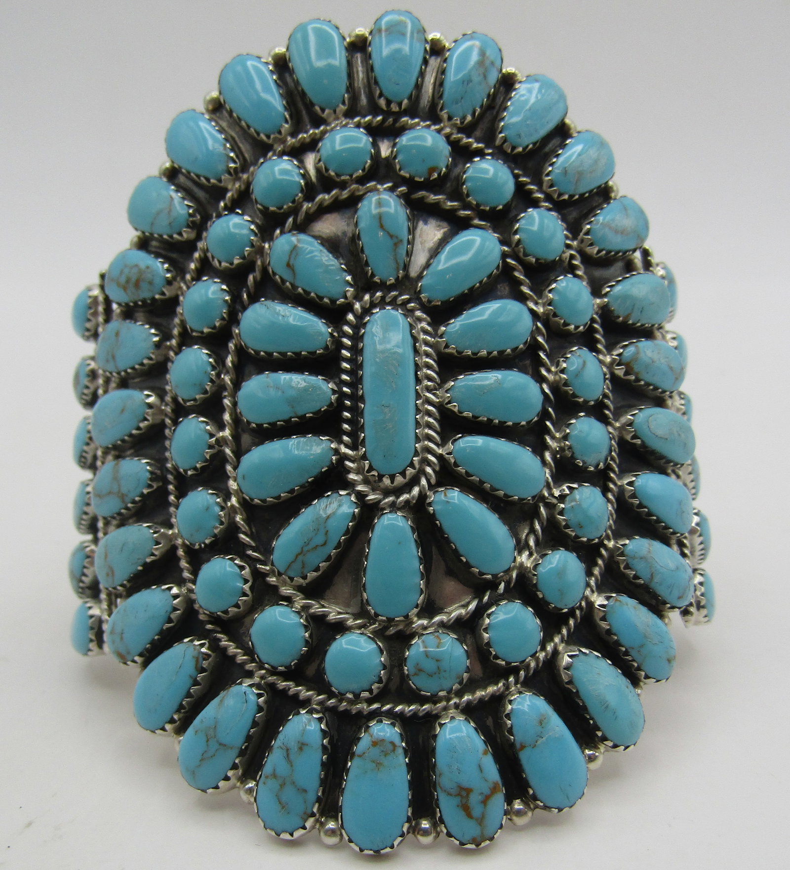 BENALLY TURQUOISE CLUSTER CUFF STERLING SILVER: ARTIST HALLMARKED "TB STERLING" SILVER. NATIVE AMERICAN SOUTHWEST NAVAJO INDIAN BRACELET. TOP MEASURES 3 INCHES WIDE. WEIGHS 46.3 GRAMS. FITS A 7 1/2 INCH WRIST WITH A 37MM GAP. EXCELLENT CONDITION. W