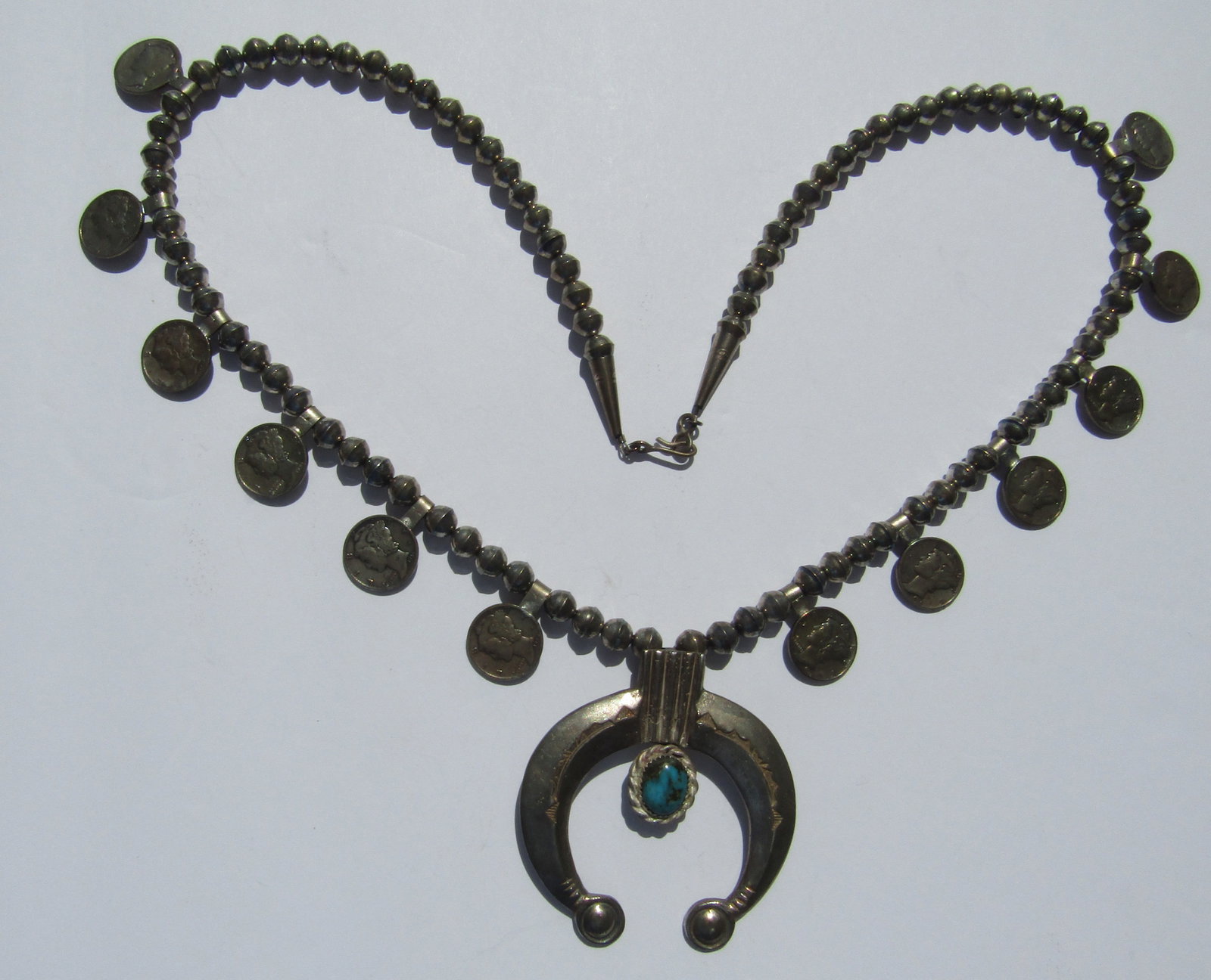 STERLING SILVER TURQUOISE SQUASH NECKLACE MERCURY: NATIVE TURQUOISE STERLING BEAD NECKLACE WITH 12 SILVER MERCURY DIMES AND 2 INCH PENDANT. 28 INCH LONG AND WEIGHS100 GRAMS. USA SHIPPING $5.