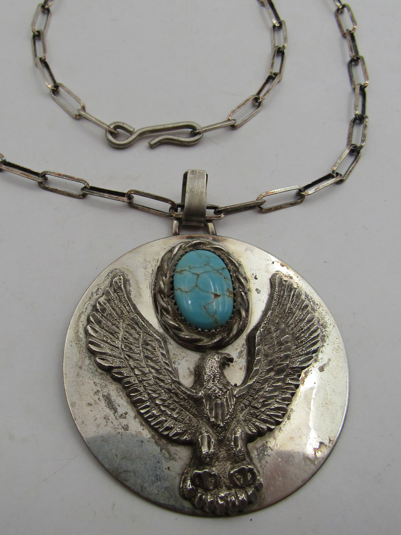 TURQUOISE STERLING SILVER EAGLE PENDANT 24" CHAIN: 2 INCH STERLING SILVER PENDANT WITH NATURAL TURQUOISE AND EAGLE ON STERLING SILVER LINK CHAIN. 24 INCH WEIGHS 37.7 GRAMS. USA SHIPPING $5