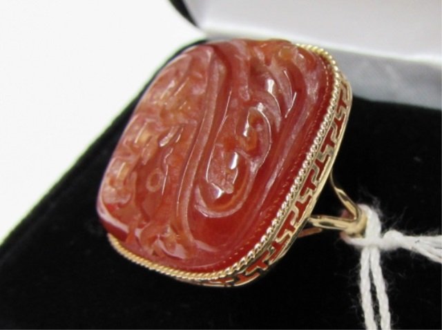 14K CARVED CARNELIAN GOLD RING: 3.69 LARGE 14K YELLOW GOLD CARVED CORELIAN RING 1INCH BY 1 INCH. SIZE 9