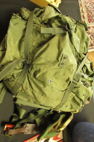 US Marine Rucksack Vietnam Cargo Backpack +Extras: 26.4. War combat field pack w/ 2 pair gloves (one wool, one leather), camo pants, 5 hats, one machete w/ sheath, one pakistan knife, two small sacks, and one Global Protection Avian Bird Flu kit.