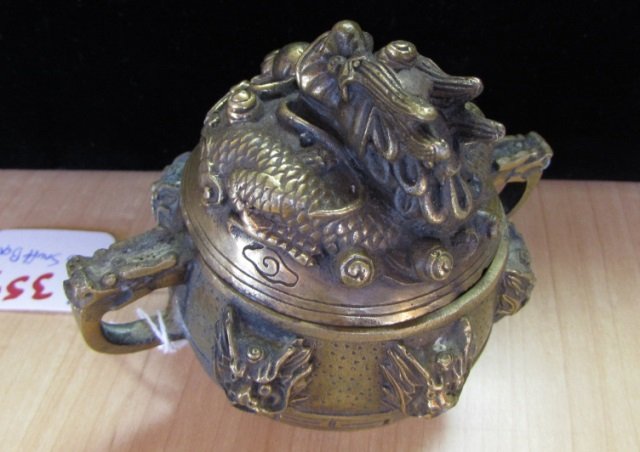 Antique Asian Brass Dragon Snuff Box: 29.38. Chinese jar has 6 holes, each as a dragon's mouth, possibly for burning incense censer. 4" tall x 3.5" diameter