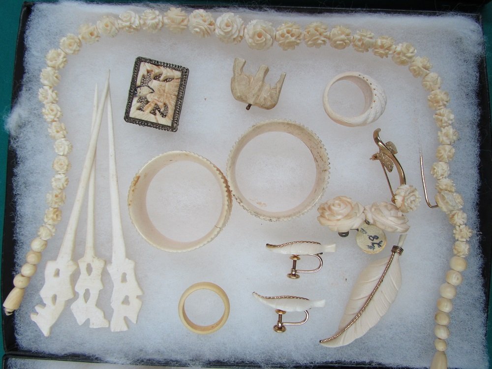 Ivory Jewelry Collection BRACELET NECKLACE, EARRING LOT: 3.0. Necklace, bracelet, pins, pendants, rings, hairpins, napkin holders and earrings mostly ivory some may be bone, some intricately designed, some metal accents.