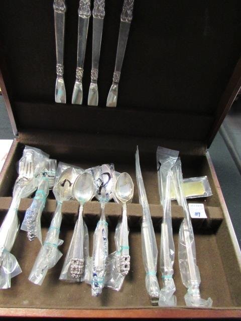 1847 Rogers Bros Silverware 39 Piece Silverplate: 19.30. Some pieces unopened new in bag. Flatware includes gorgeous wood presentation box.