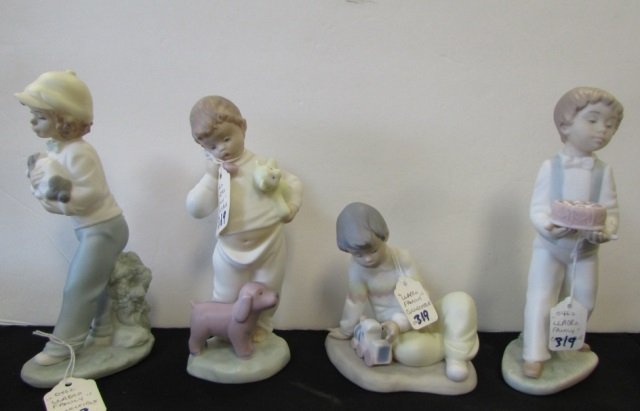 4 Lladro Golden Memories Figurines: 2.0. Girl carrying puppy dog; boy with toys; boy carrying cake; boy playing with train.