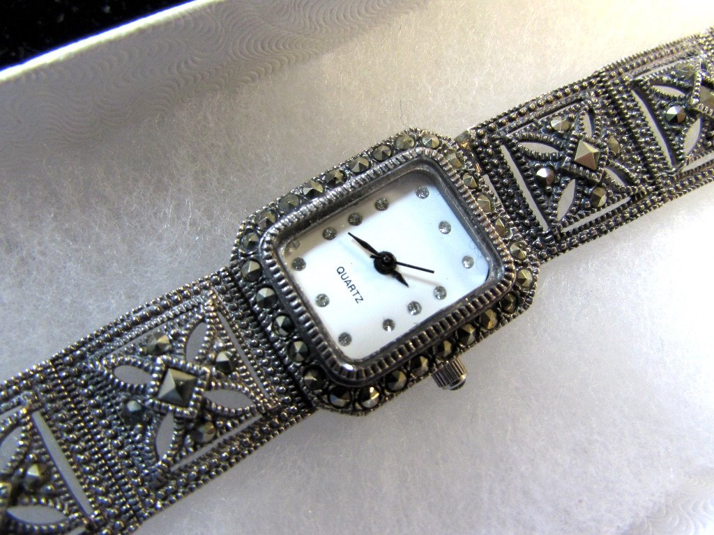 Marcasite Sterling Silver Ladies Watch Wristwatch: 2.0 Measures 7" Quartz watch. Runs great. Weighs 34 grams.