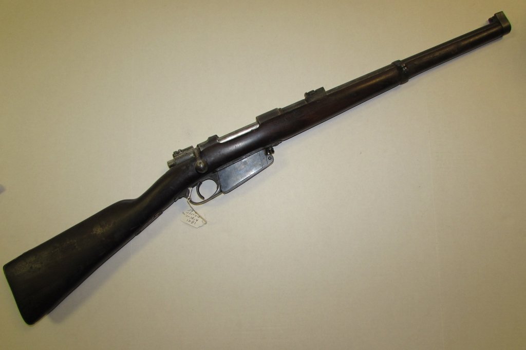 1891 Argentina Mauser 7.65: 25.28. Has several factory marks (shaking hands & a floppy hat). Barrel appears to have been shortened.